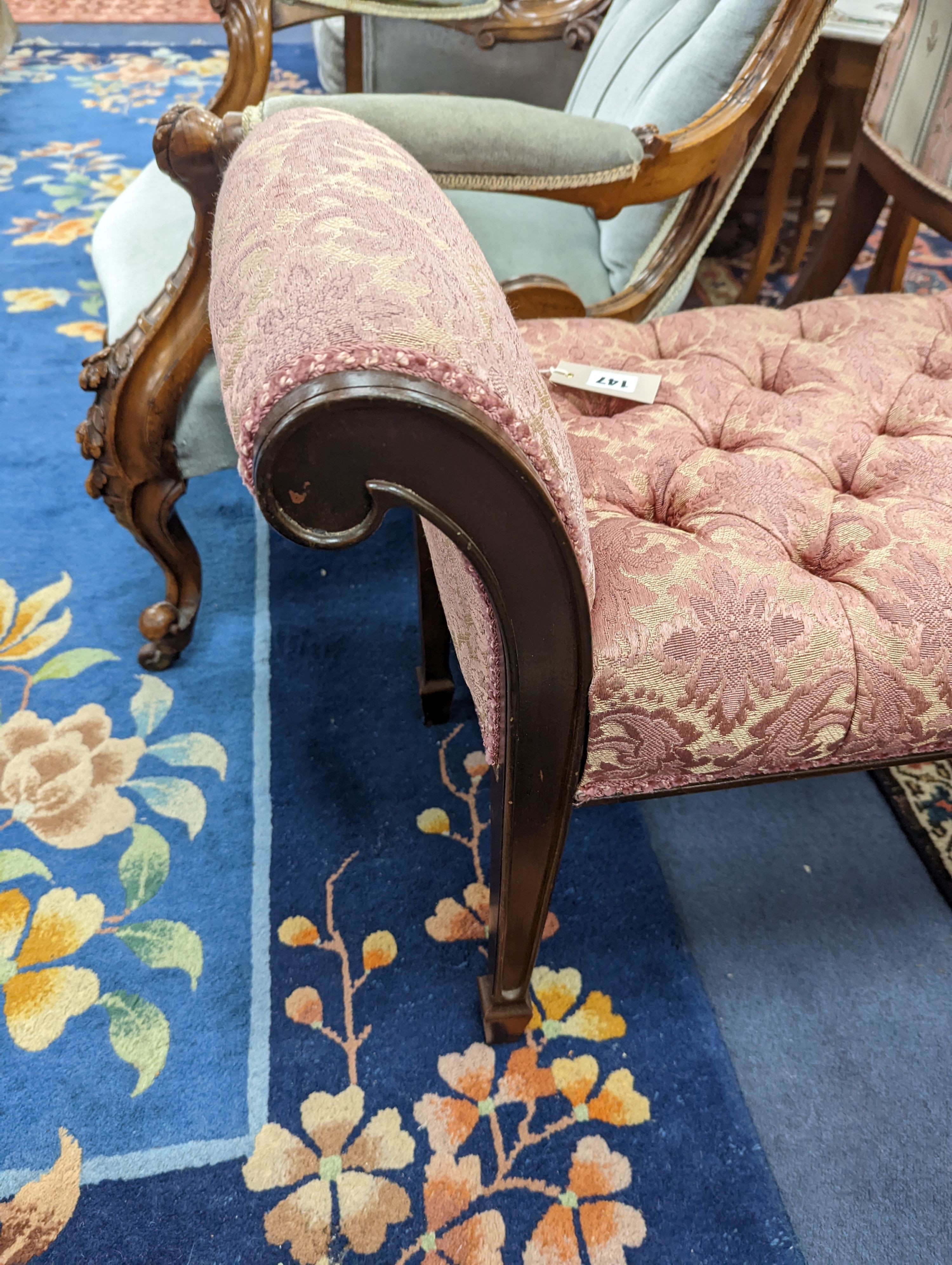 An Edwardian mahogany window seat, with deep buttoned upholstered seat, length 114cm, depth 38cm, height 57cm